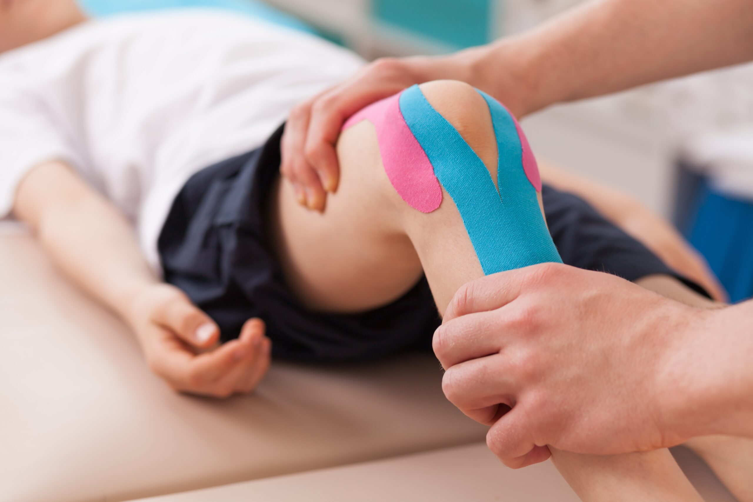 Physiotherapist,Doing,With,Child,Exercise,For,Knee